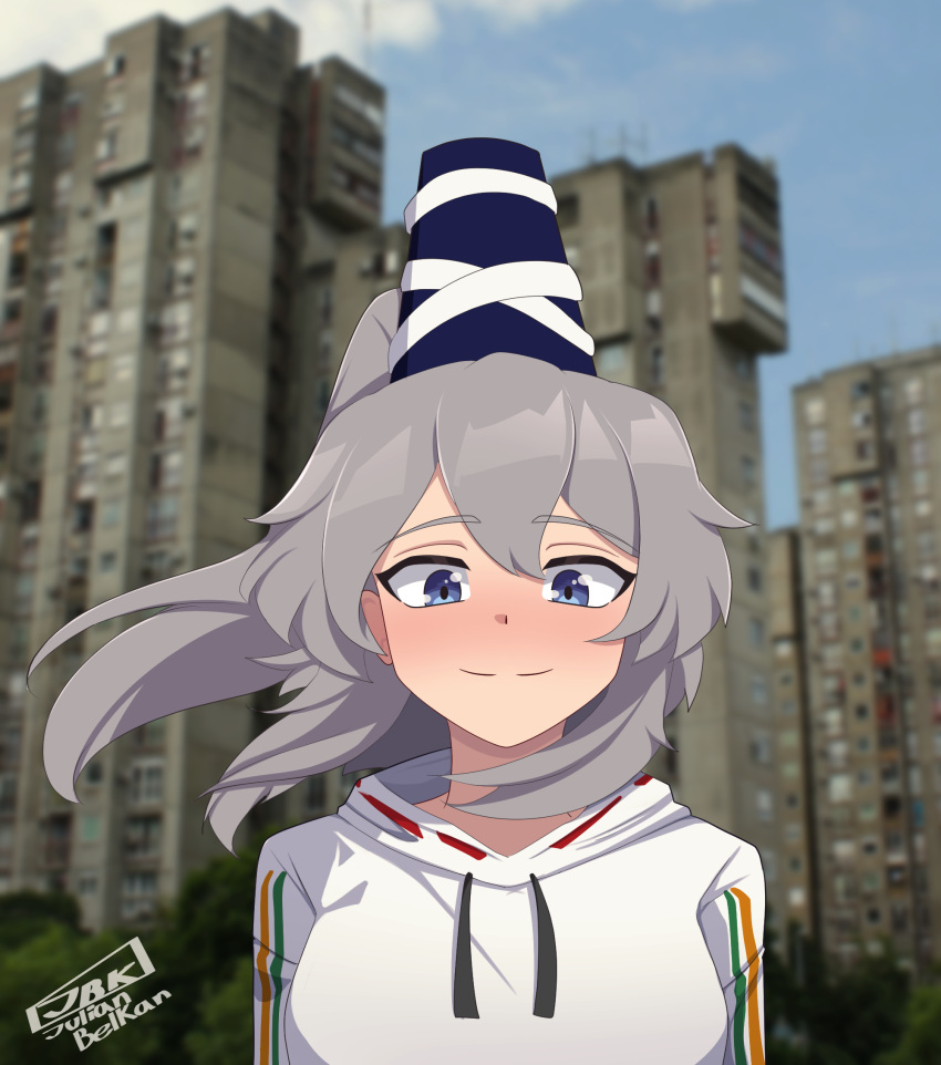 1girl, adapted_costume, blue_eyes, blue_hat, blurry, blurry_background, blush, building